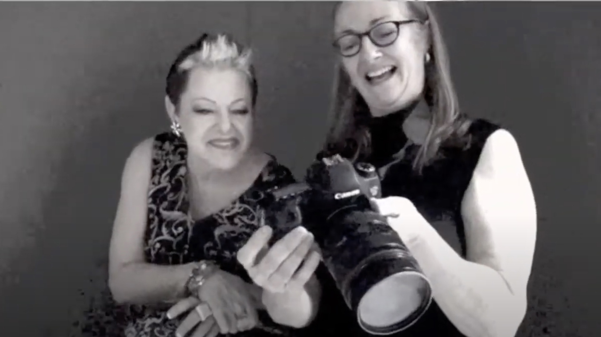 two-ladies-laughing-while-looking-at-the-camera-at-a-boudoir-photo-shoot